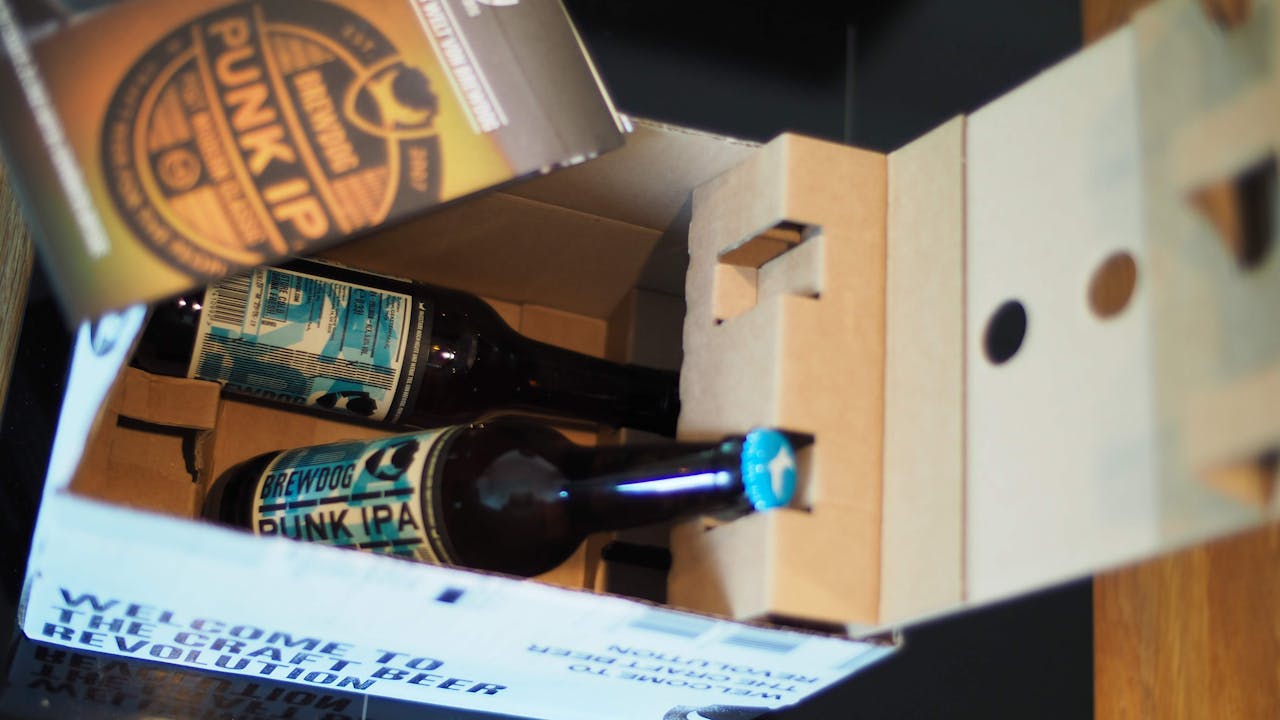 Offerings Close-up of BrewDog Punk IPA bottles in a cardboard box.